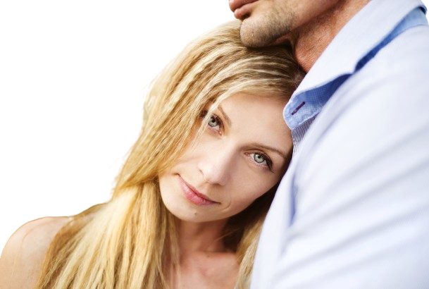 happy young couple in love hugging outside in a park